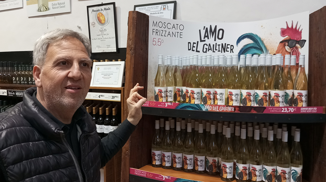 Visitor explores local products and wines in the traditional Xalo winery in the Alicante region of Spain.