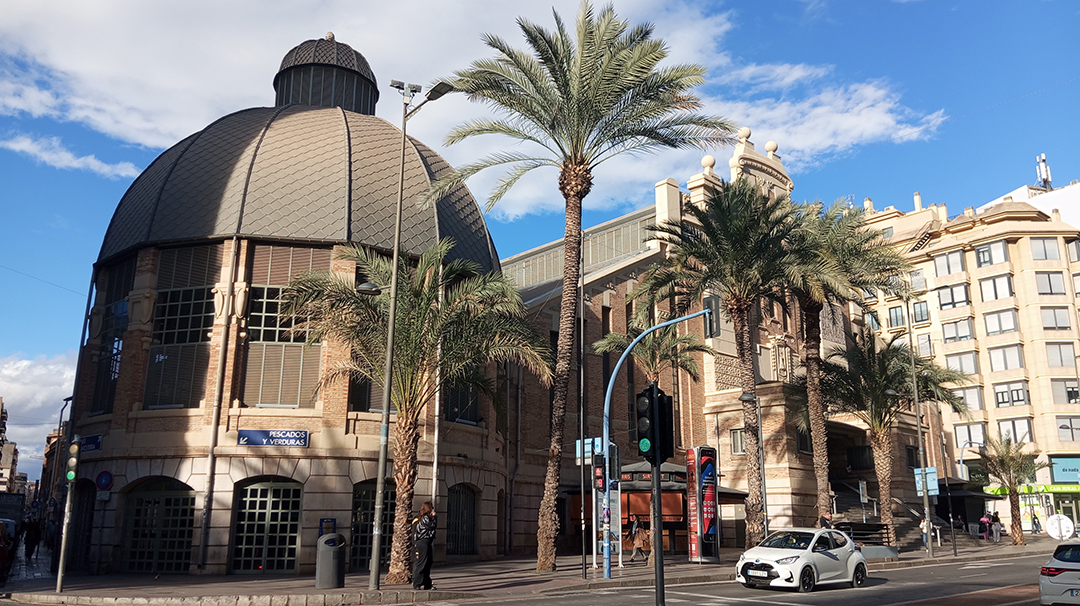 Modern architecture and palm trees in central Alicante create the characteristic urban atmosphere of this Spanish seaside city.