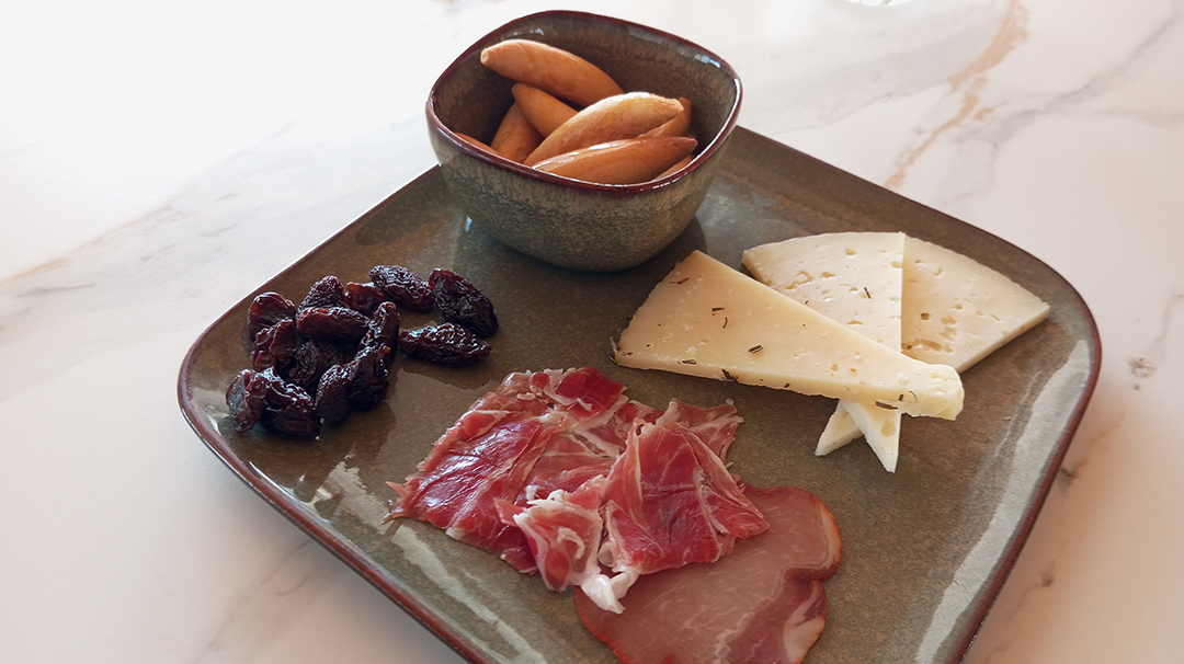 Traditional cheeses, olives and cured meat delicacies represent the rich cuisine of the Alicante region in Spain.