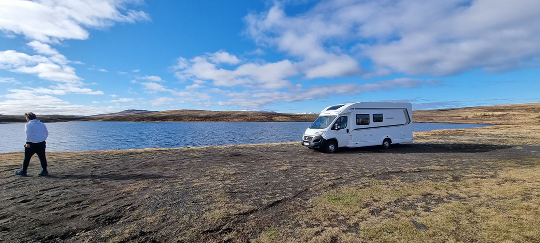 A peaceful lake in northern Iceland offers a perfect view of Iceland’s raw and open landscape.