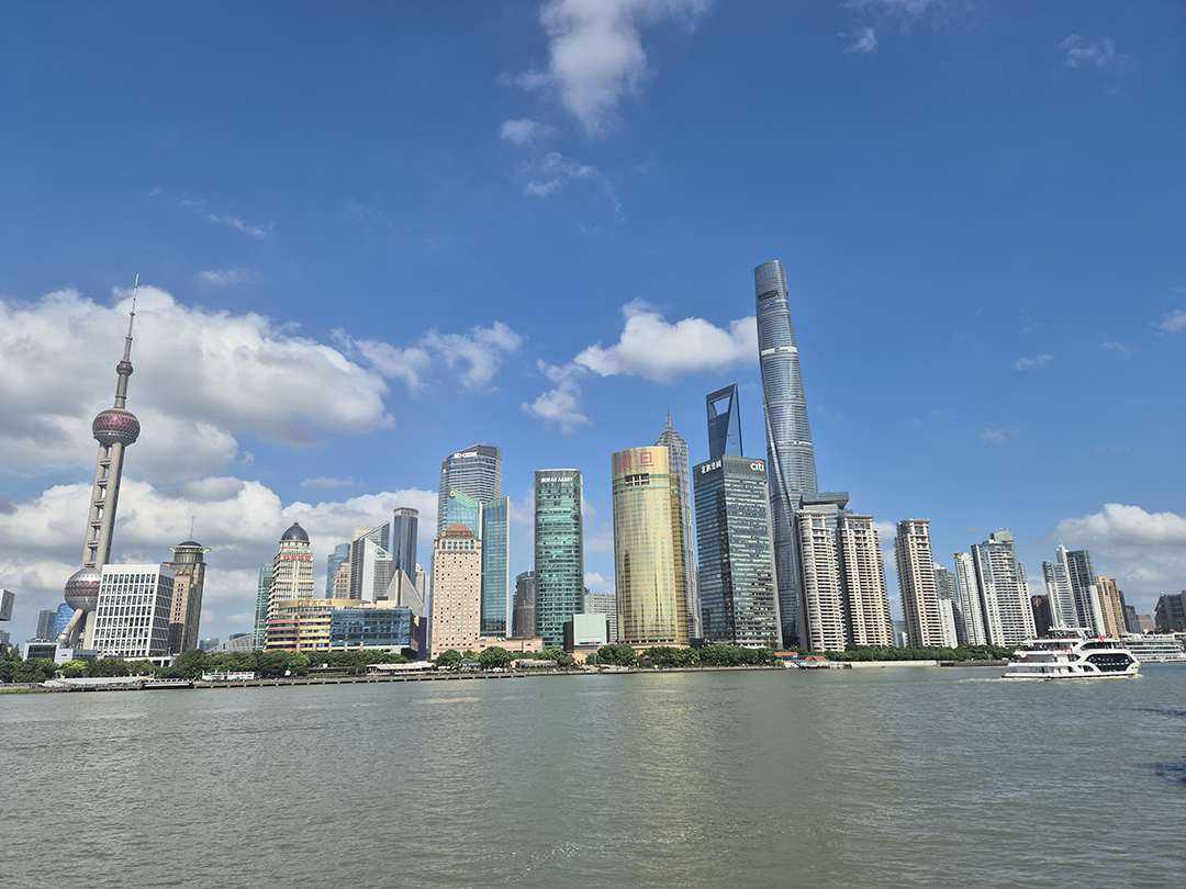 The modern Shanghai skyline along the Huangpu River showcases China’s rapidly developing metropolis.