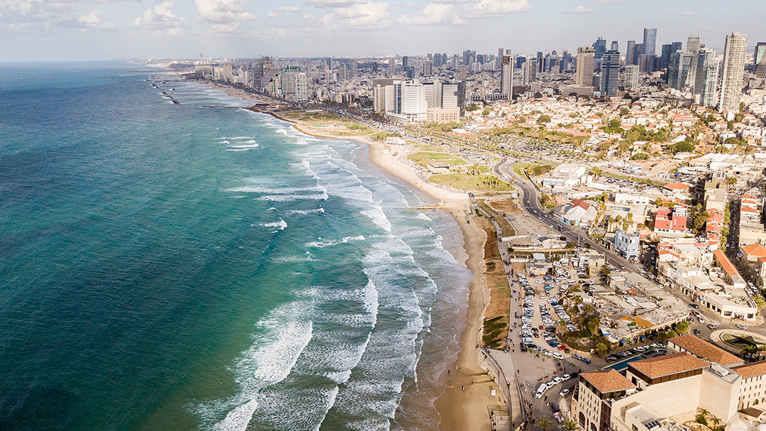 Panoramic view of Tel Aviv’s coastline where the modern city meets the Mediterranean Sea and the vibrant atmosphere of Israel.