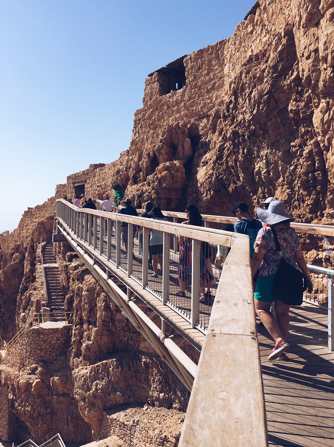 Visitors explore the ancient fortress of Masada above the Israeli desert and the Dead Sea.