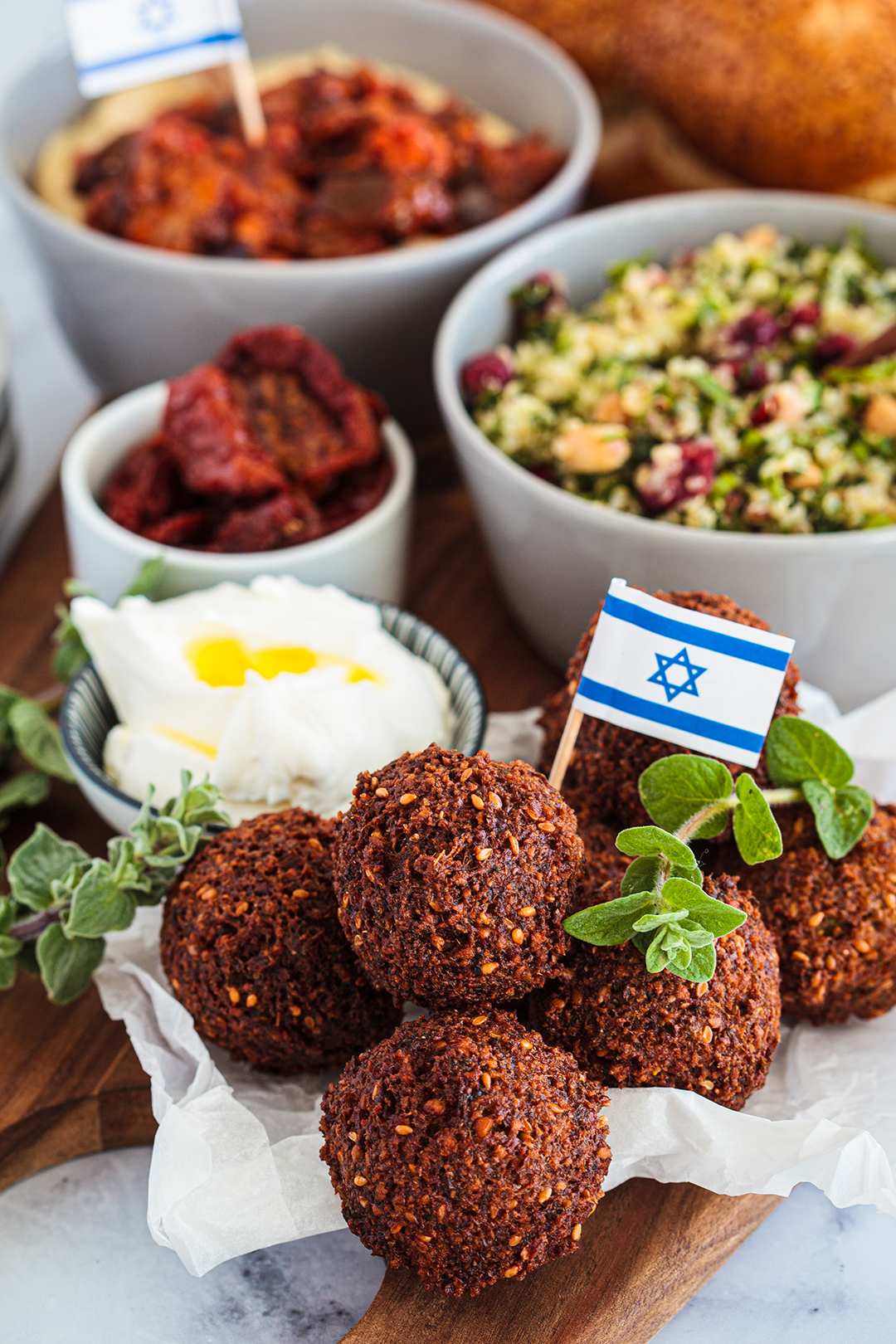 Traditional Israeli falafel with local side dishes represents the popular cuisine of Tel Aviv and Israel.