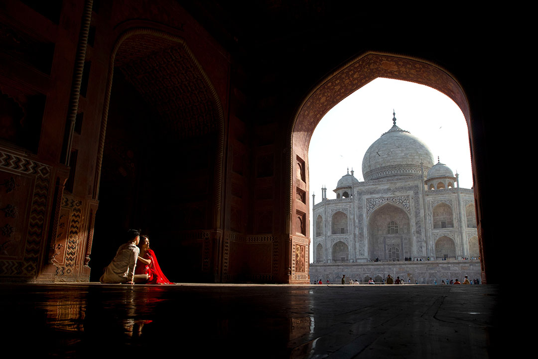 View of the Taj Mahal through the monumental entrance to the complex.