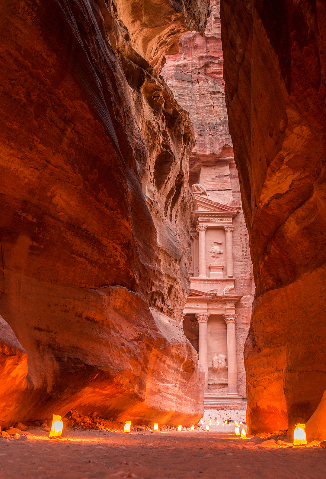 View through the Siq canyon towards the famous Treasury in Petra.