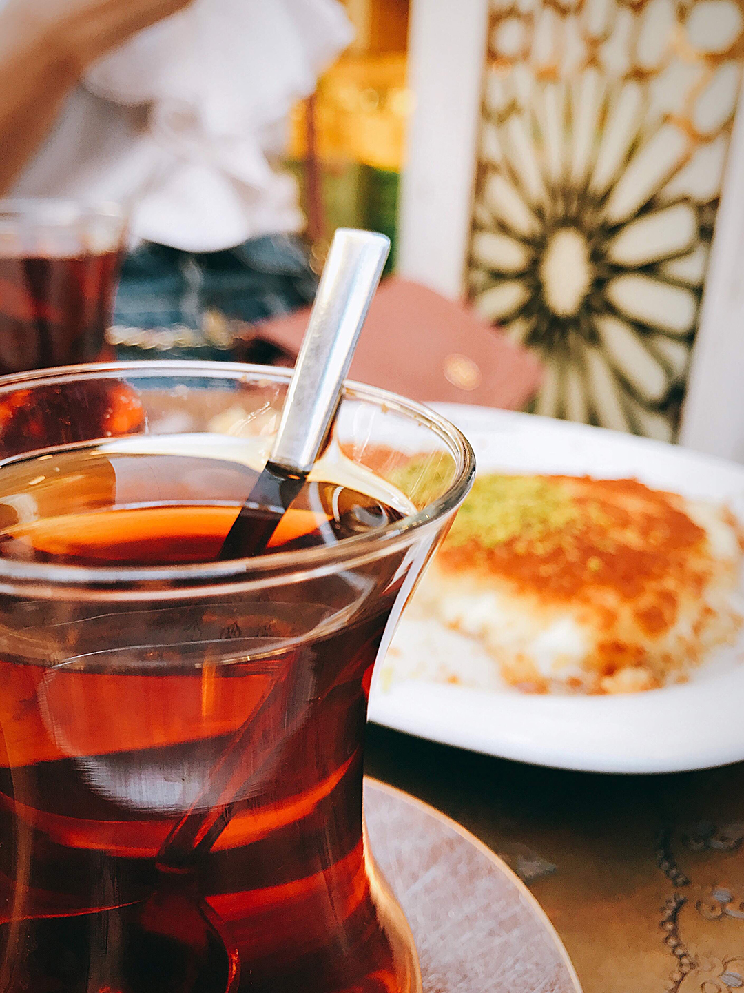 Traditional Turkish tea served with a local dessert.