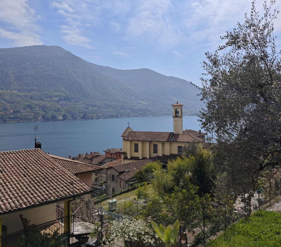 The view from the mountain village of Zone overlooks Lake Iseo, where alpine scenery, historic villages and peaceful landscapes create the perfect Northern Italy slow travel experience.