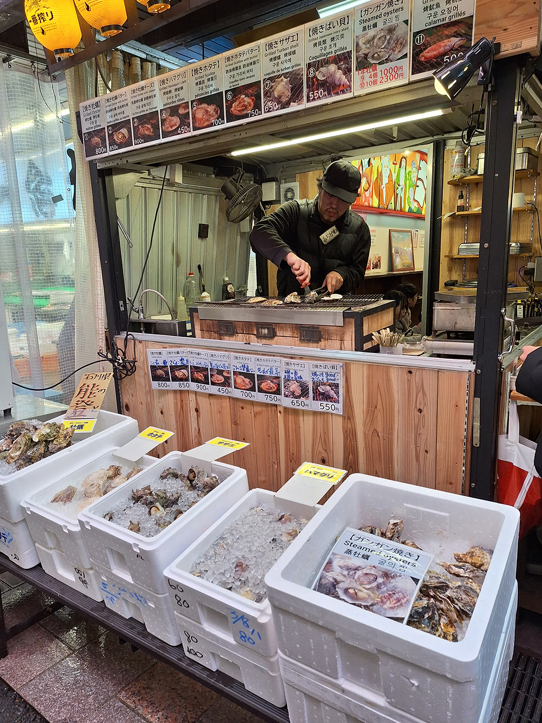 Fresh seafood stalls at Omicho Market capture the authentic flavours of Kanazawa, where local chefs prepare regional delicacies in front of curious visitors.