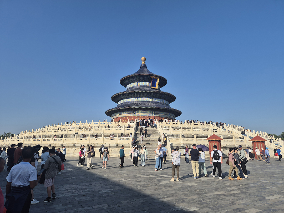 Temple of Heaven in Beijing with its iconic circular roof as visitors explore one of China's most important sacred sites.