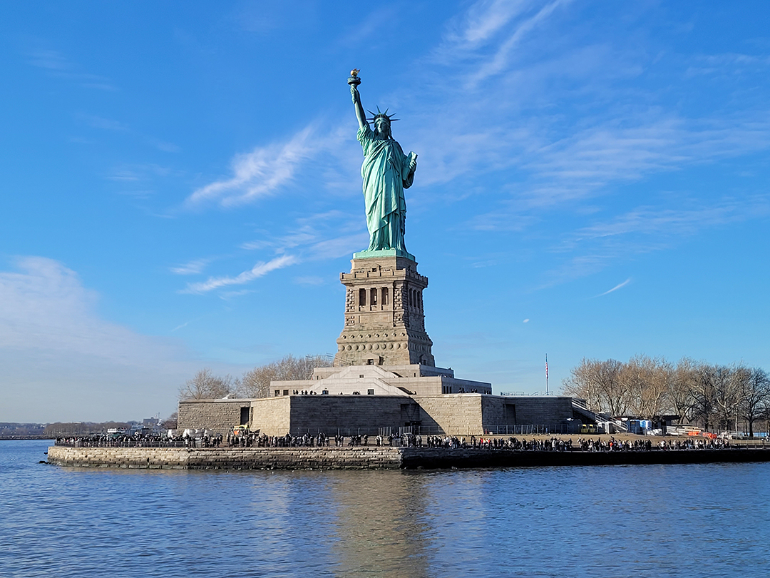 The Statue of Liberty on Liberty Island is a symbol of freedom and hope, welcoming millions of immigrants and standing as one of New York City's most iconic landmarks.